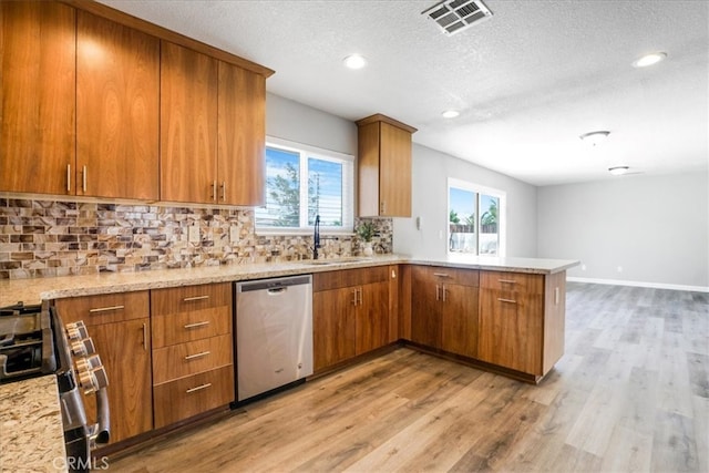 14351 Cronese Rd, Apple Valley, CA 92307 - kitchen with stainless steel appliances, a sink, a peninsula, tasteful backsplash, and recessed lighting