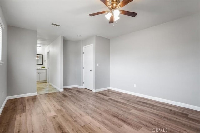 14351 Cronese Rd, Apple Valley, CA 92307 - spare room with light wood finished floors, a ceiling fan, and baseboards