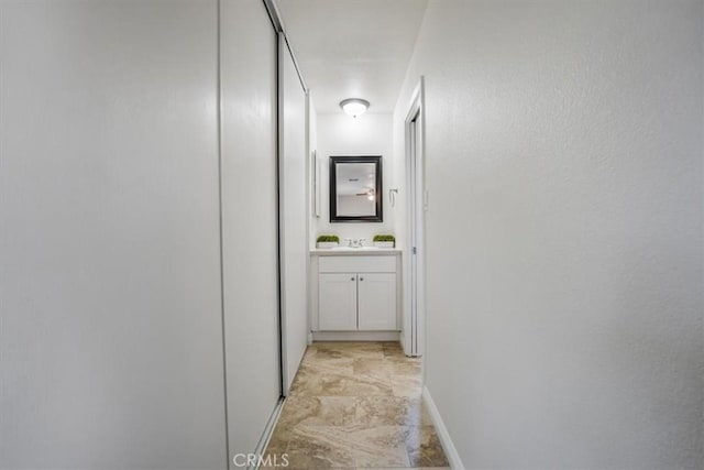 14351 Cronese Rd, Apple Valley, CA 92307 - hallway featuring a sink and baseboards