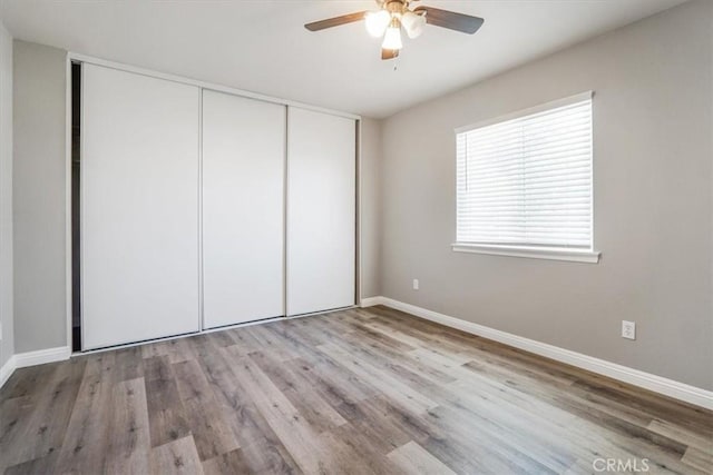 14351 Cronese Rd, Apple Valley, CA 92307 - unfurnished bedroom with a closet, wood finished floors, and baseboards