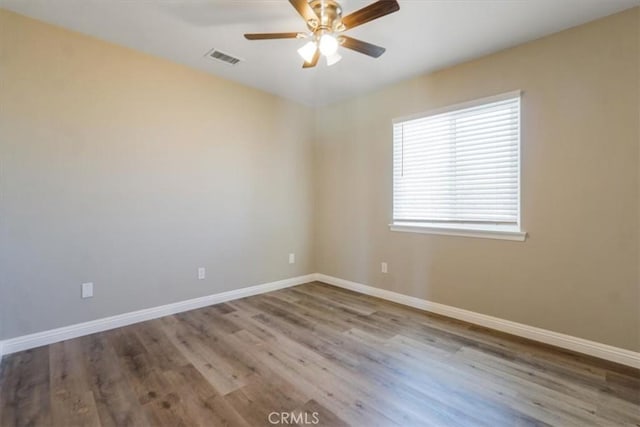 14351 Cronese Rd, Apple Valley, CA 92307 - empty room with a ceiling fan, baseboards, and wood finished floors