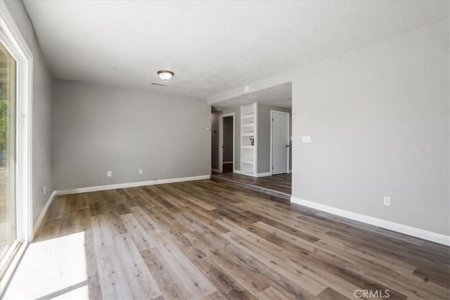 14351 Cronese Rd, Apple Valley, CA 92307 - unfurnished room featuring wood finished floors and baseboards