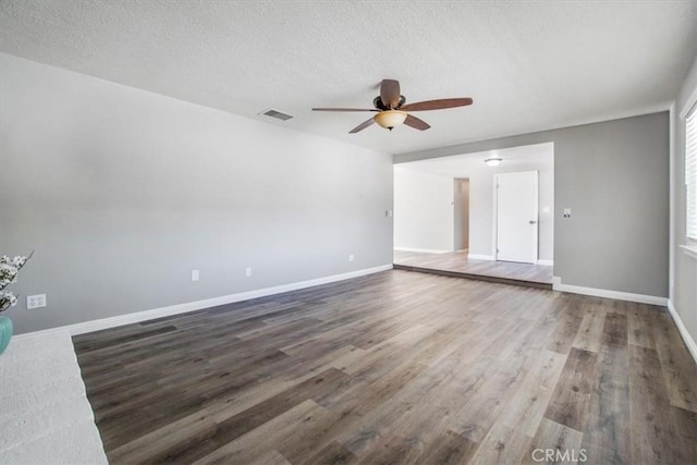 14351 Cronese Rd, Apple Valley, CA 92307 - empty room featuring a ceiling fan, wood finished floors, baseboards, and a textured ceiling