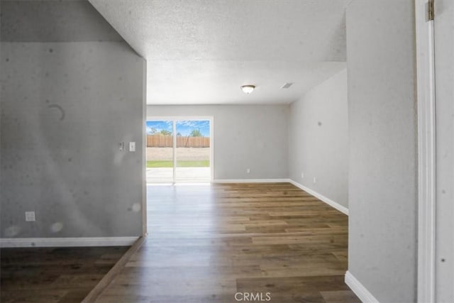 14351 Cronese Rd, Apple Valley, CA 92307 - empty room featuring wood finished floors, baseboards, and a textured ceiling