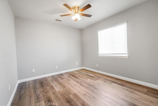 14351 Cronese Rd, Apple Valley, CA 92307 - spare room featuring a ceiling fan, wood finished floors, and baseboards