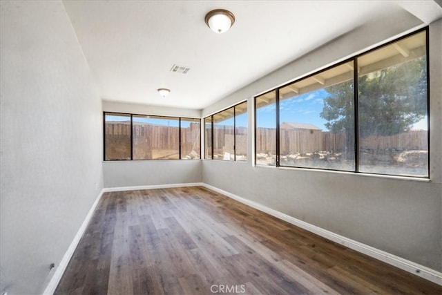 14351 Cronese Rd, Apple Valley, CA 92307 - empty room with baseboards, wood finished floors, and healthy amount of natural light
