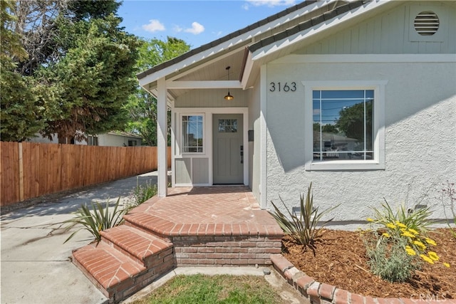 3163 W 170th St, Torrance, CA 90504 - doorway to property featuring fence and stucco siding