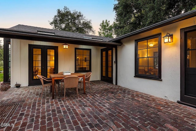 1555 Scenic Dr, Pasadena, CA 91103 - patio terrace at dusk featuring french doors, a patio, and outdoor dining area