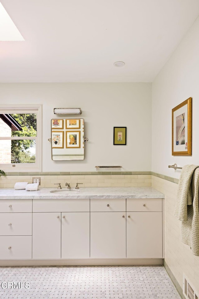 1555 Scenic Dr, Pasadena, CA 91103 - bathroom with tile walls, vanity, and a wainscoted wall