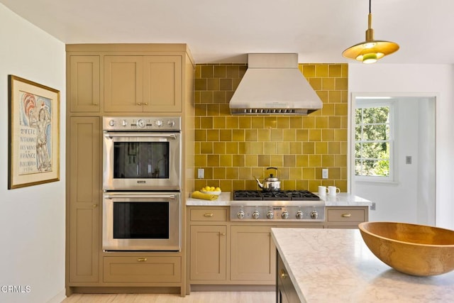 1555 Scenic Dr, Pasadena, CA 91103 - kitchen featuring ventilation hood, appliances with stainless steel finishes, tasteful backsplash, and pendant lighting