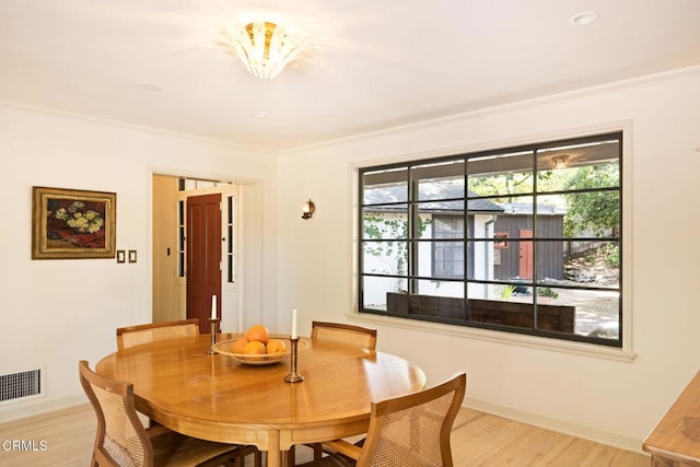 1555 Scenic Dr, Pasadena, CA 91103 - dining area featuring light wood-style floors and crown molding