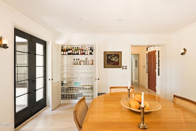 1555 Scenic Dr, Pasadena, CA 91103 - dining area featuring french doors, plenty of natural light, light wood-type flooring, and ornamental molding