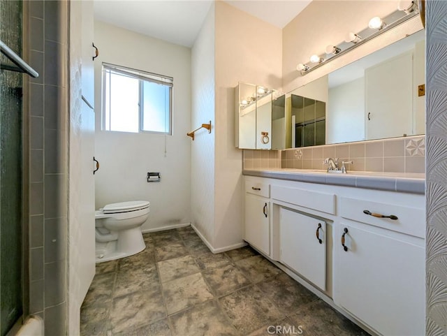 11674 Oak Ln, Yucaipa, CA 92399 - bathroom with tasteful backsplash, vanity, a shower with shower door, and stone finish floors
