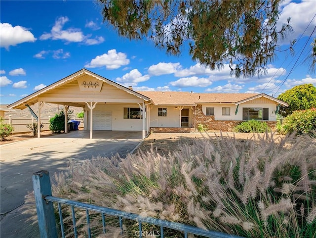 11674 Oak Ln, Yucaipa, CA 92399 - single story home with a garage, driveway, stucco siding, an attached carport, and stone siding