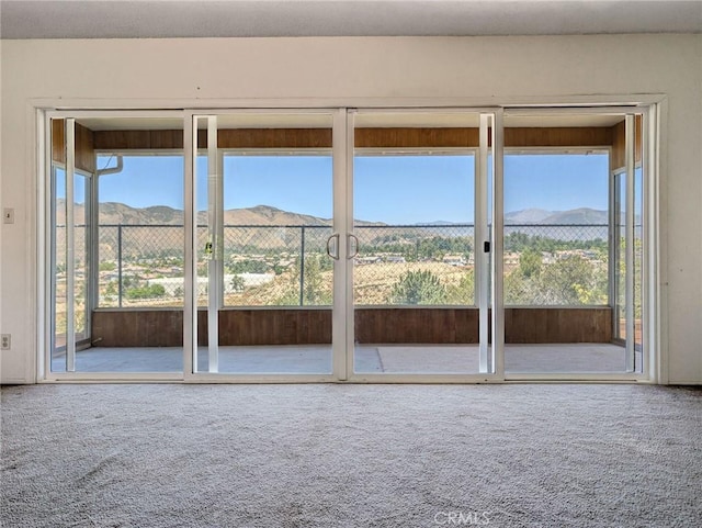 11674 Oak Ln, Yucaipa, CA 92399 - unfurnished sunroom with a mountain view, carpet floors, and plenty of natural light