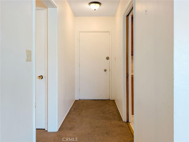 11674 Oak Ln, Yucaipa, CA 92399 - hallway featuring light colored carpet and baseboards