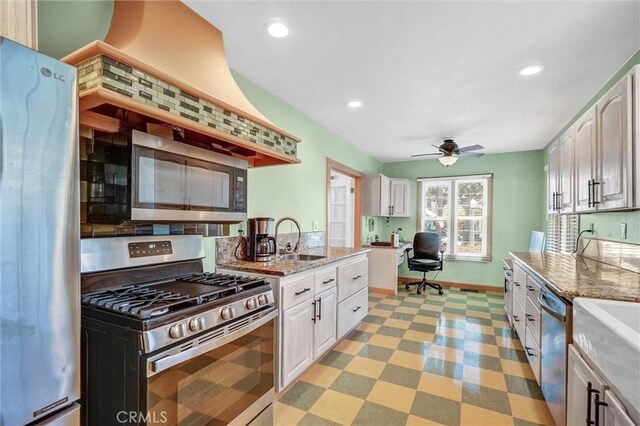 521 W Whiting Ave, Fullerton, CA 92832 - kitchen featuring stainless steel appliances, a ceiling fan, light stone counters, recessed lighting, and white cabinets