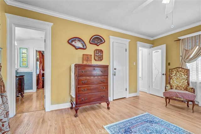 521 W Whiting Ave, Fullerton, CA 92832 - sitting room featuring light wood-style flooring, ornamental molding, and ceiling fan