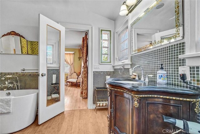 521 W Whiting Ave, Fullerton, CA 92832 - bar area with plenty of natural light, light wood-style flooring, a wainscoted wall, and tile walls