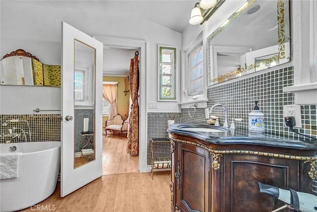521 W Whiting Ave, Fullerton, CA 92832 - bar area featuring plenty of natural light, light wood finished floors, wainscoting, and tile walls