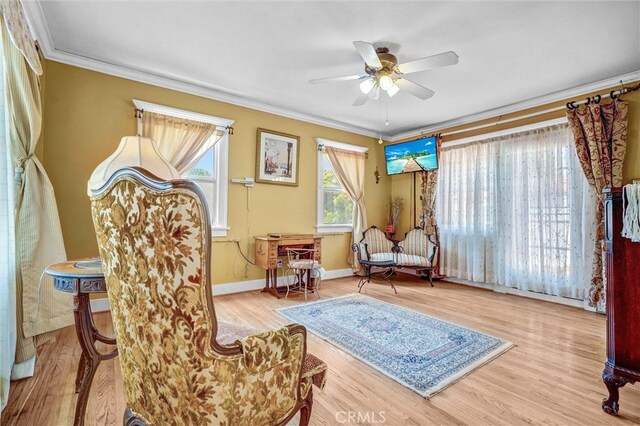 521 W Whiting Ave, Fullerton, CA 92832 - living area featuring ornamental molding, ceiling fan, and wood finished floors