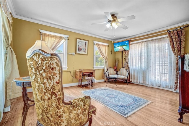 521 W Whiting Ave, Fullerton, CA 92832 - sitting room featuring crown molding, a ceiling fan, and wood finished floors