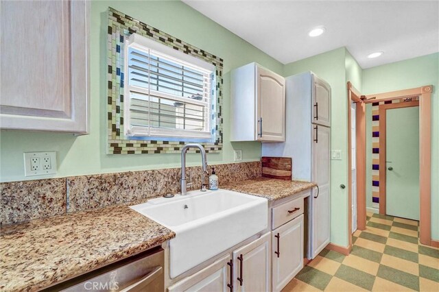 521 W Whiting Ave, Fullerton, CA 92832 - kitchen with light floors, light stone counters, dishwasher, and recessed lighting