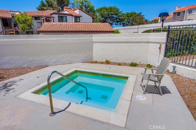 6970 Sandpiper Pl, Carlsbad, CA 92009 - view of swimming pool with an in-ground hot tub and a fenced backyard