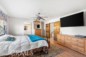 bedroom featuring wood finished floors and a ceiling fan