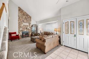 tiled living room with high vaulted ceiling