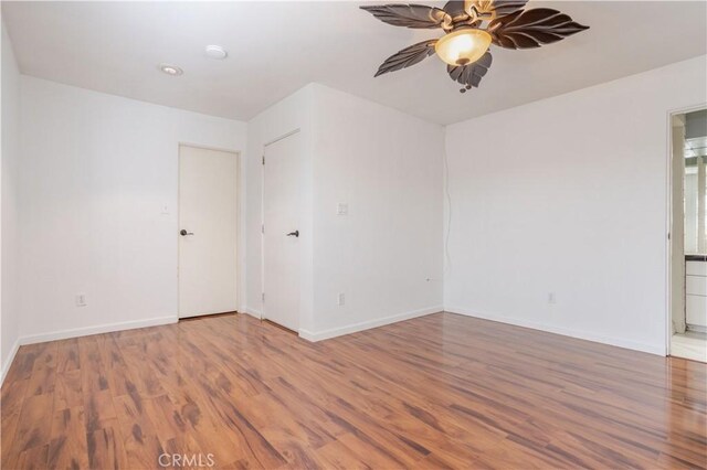 28083 Langside Ave, Canyon Country, CA 91351 - empty room with wood finished floors, a ceiling fan, and baseboards