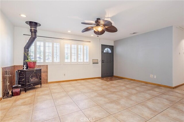28083 Langside Ave, Canyon Country, CA 91351 - tiled foyer featuring a wood stove, ceiling fan, recessed lighting, and baseboards