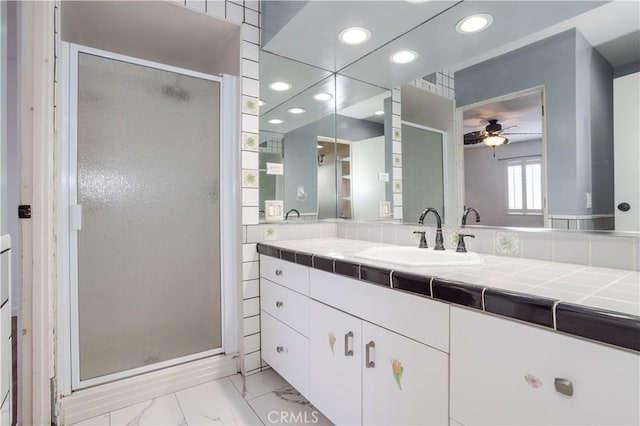 28083 Langside Ave, Canyon Country, CA 91351 - bathroom with marble look tile flooring, a stall shower, a ceiling fan, vanity, and recessed lighting
