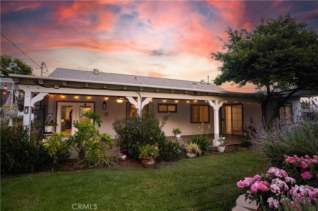 28083 Langside Ave, Canyon Country, CA 91351 - back of house at dusk with a yard and stucco siding