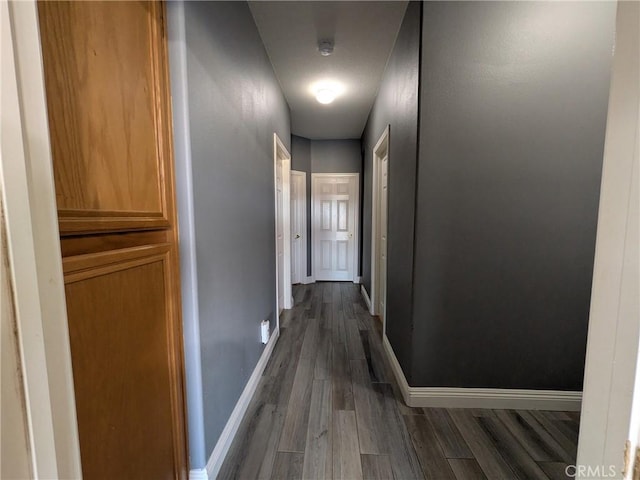 22132 Esaws Rd, Apple Valley, CA 92307 - corridor with dark wood finished floors and baseboards