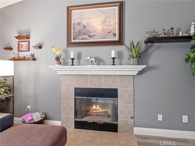 22132 Esaws Rd, Apple Valley, CA 92307 - detailed view of baseboards, a fireplace, and wood finished floors