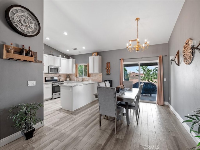 22132 Esaws Rd, Apple Valley, CA 92307 - dining room featuring lofted ceiling, a chandelier, light wood-style flooring, recessed lighting, and baseboards