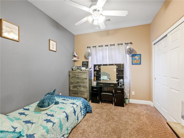 22132 Esaws Rd, Apple Valley, CA 92307 - bedroom with light carpet, a closet, and a ceiling fan