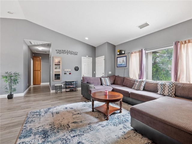 22132 Esaws Rd, Apple Valley, CA 92307 - living room featuring light wood finished floors, baseboards, and high vaulted ceiling