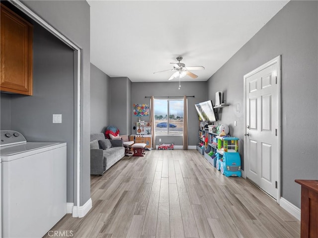 22132 Esaws Rd, Apple Valley, CA 92307 - recreation room with ceiling fan, light wood-style flooring, baseboards, and independent washer and dryer