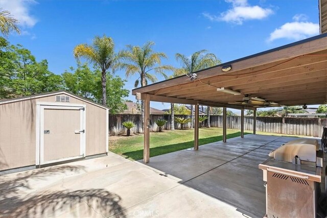 8433 Lindenhurst St, Riverside, CA 92508 - fenced backyard featuring a patio, a storage shed, and ceiling fan