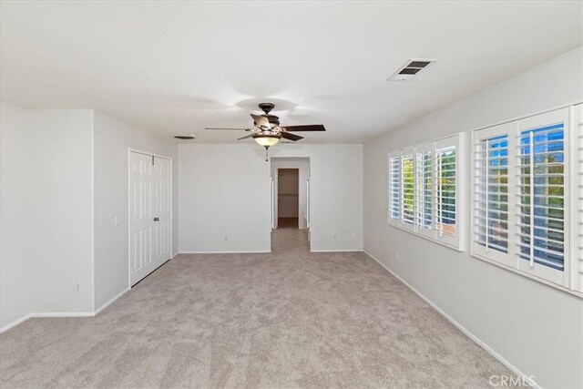 8433 Lindenhurst St, Riverside, CA 92508 - spare room featuring light carpet and ceiling fan