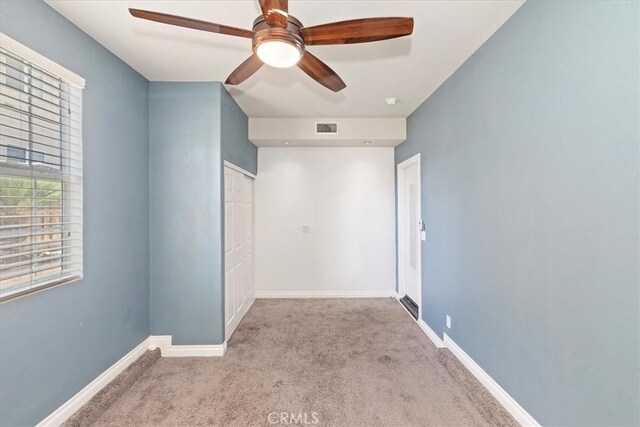 8433 Lindenhurst St, Riverside, CA 92508 - unfurnished bedroom with carpet, a ceiling fan, and a closet
