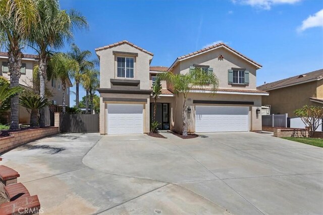 8433 Lindenhurst St, Riverside, CA 92508 - mediterranean / spanish home with an attached garage, concrete driveway, stucco siding, and a tiled roof