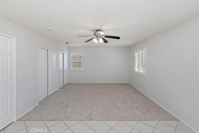 8433 Lindenhurst St, Riverside, CA 92508 - unfurnished bedroom featuring light carpet, a closet, and ceiling fan