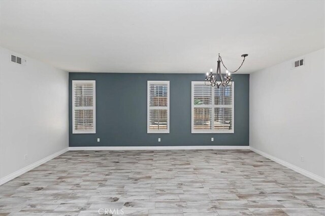 8433 Lindenhurst St, Riverside, CA 92508 - spare room with a chandelier and wood finished floors