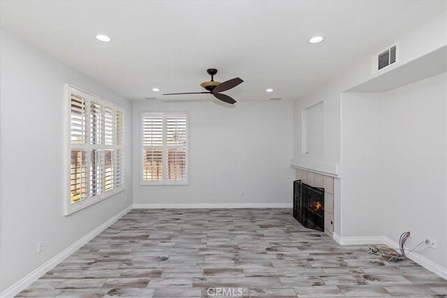 8433 Lindenhurst St, Riverside, CA 92508 - unfurnished living room with a tile fireplace, recessed lighting, ceiling fan, and light wood finished floors