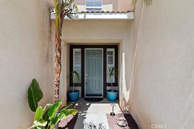 8433 Lindenhurst St, Riverside, CA 92508 - doorway to property with stucco siding