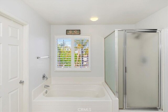 8433 Lindenhurst St, Riverside, CA 92508 - bathroom featuring a shower stall and a bath