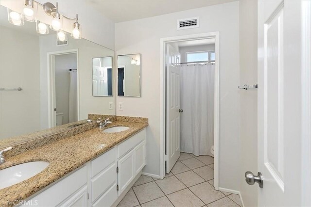 8433 Lindenhurst St, Riverside, CA 92508 - full bathroom featuring double vanity and tile patterned floors